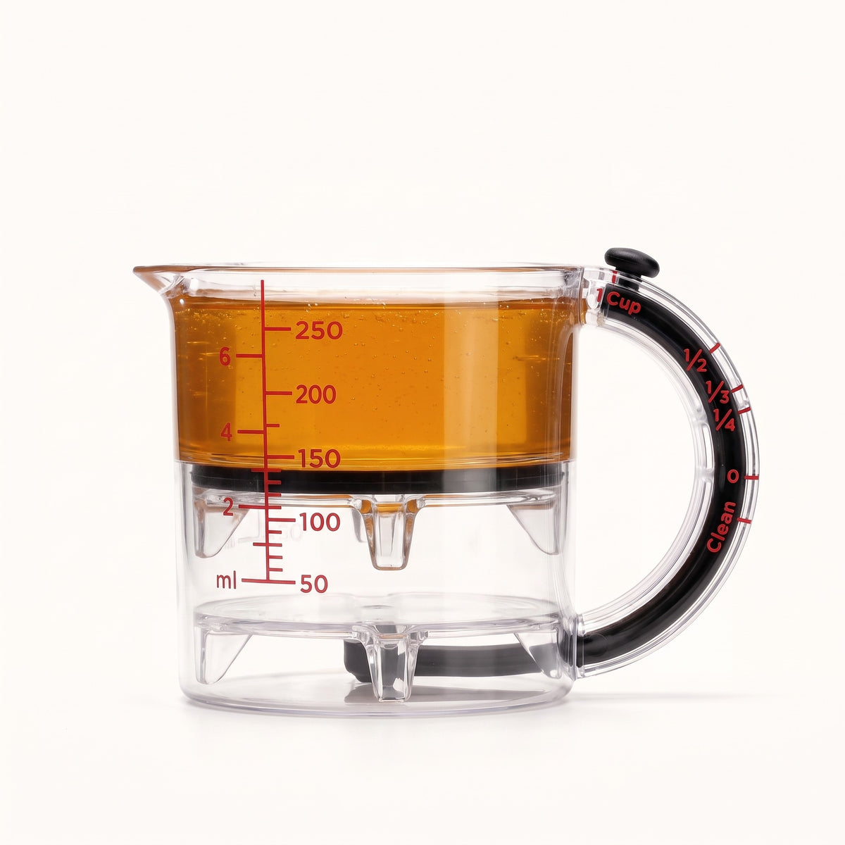 Measuring cup set to half a cup of honey