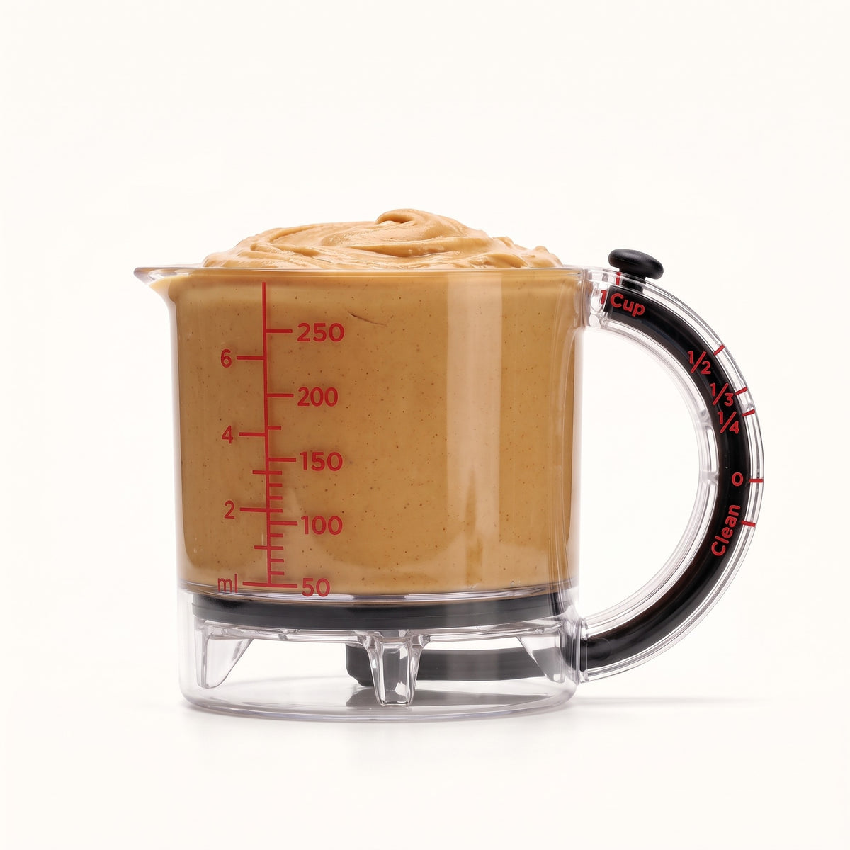 Measuring cup filled with peanut butter
